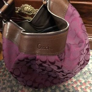 purple coach purse with lots of space and pockets